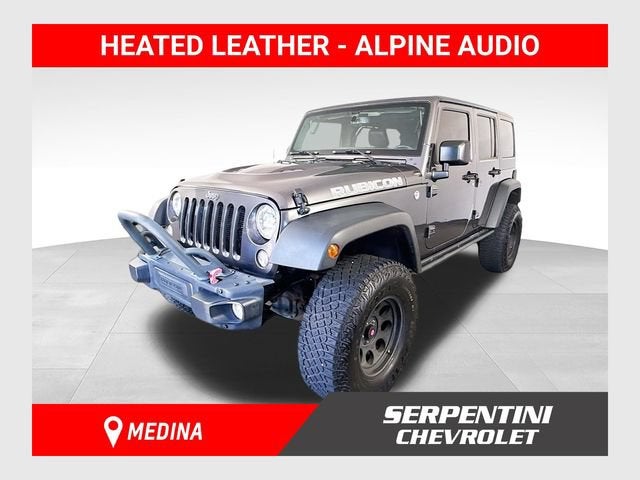 2016 Jeep Wrangler Unlimited Rubicon Hard Rock in Gray — front three-quarter view