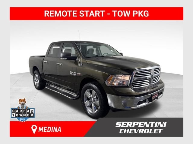 2013 RAM 1500 Big Horn in Brown — front three-quarter view